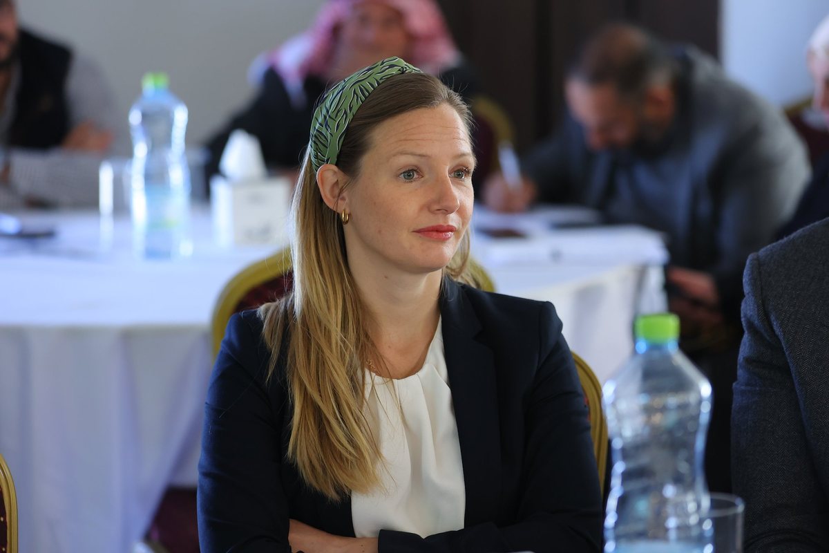 A guest listening at a round table