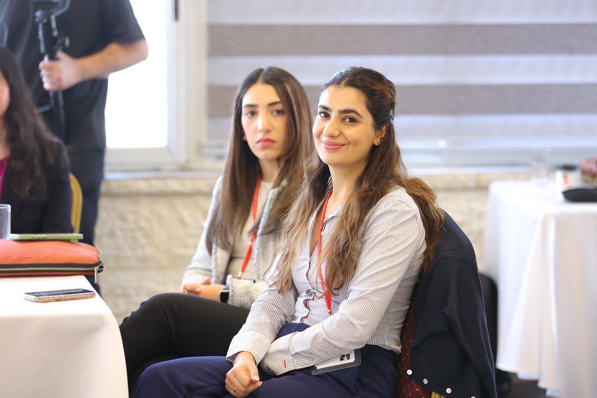 Two participants listening at a workshop
