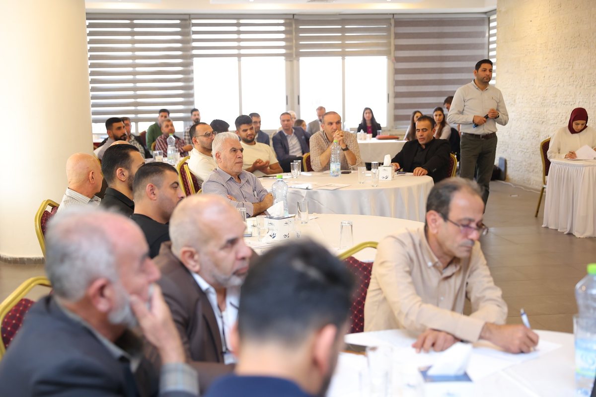 Participants at round tables during a session