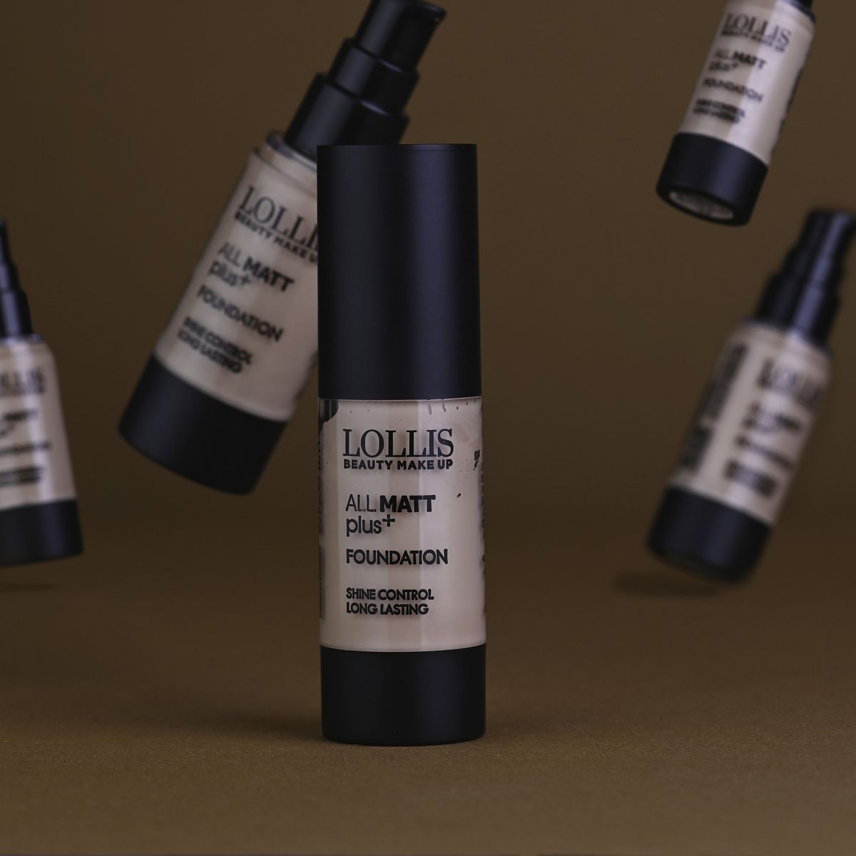 A LOLLIS foundation bottle with others floating around it