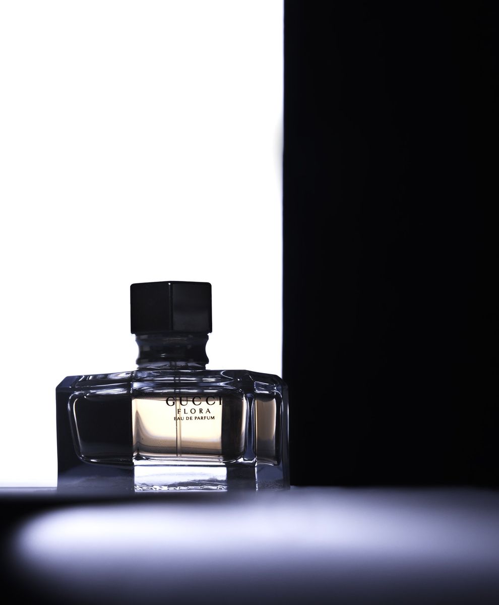 A perfume bottle in a beam of light