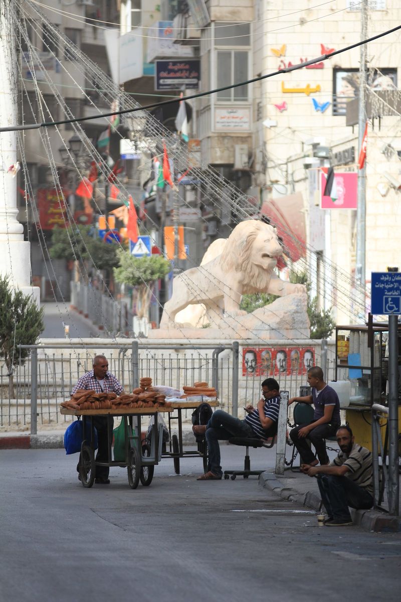 Street vendors with carts near Al-Manara
