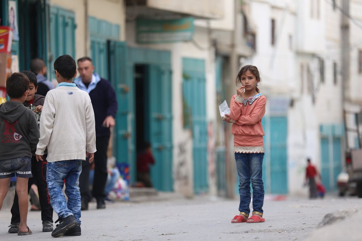 A girl standing in a market street