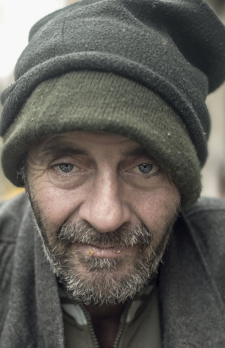 A man in a green wool hat