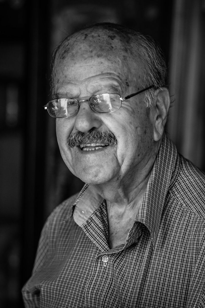 An old man in glasses, black and white