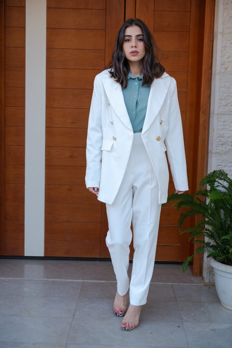 A white suit at a wooden door