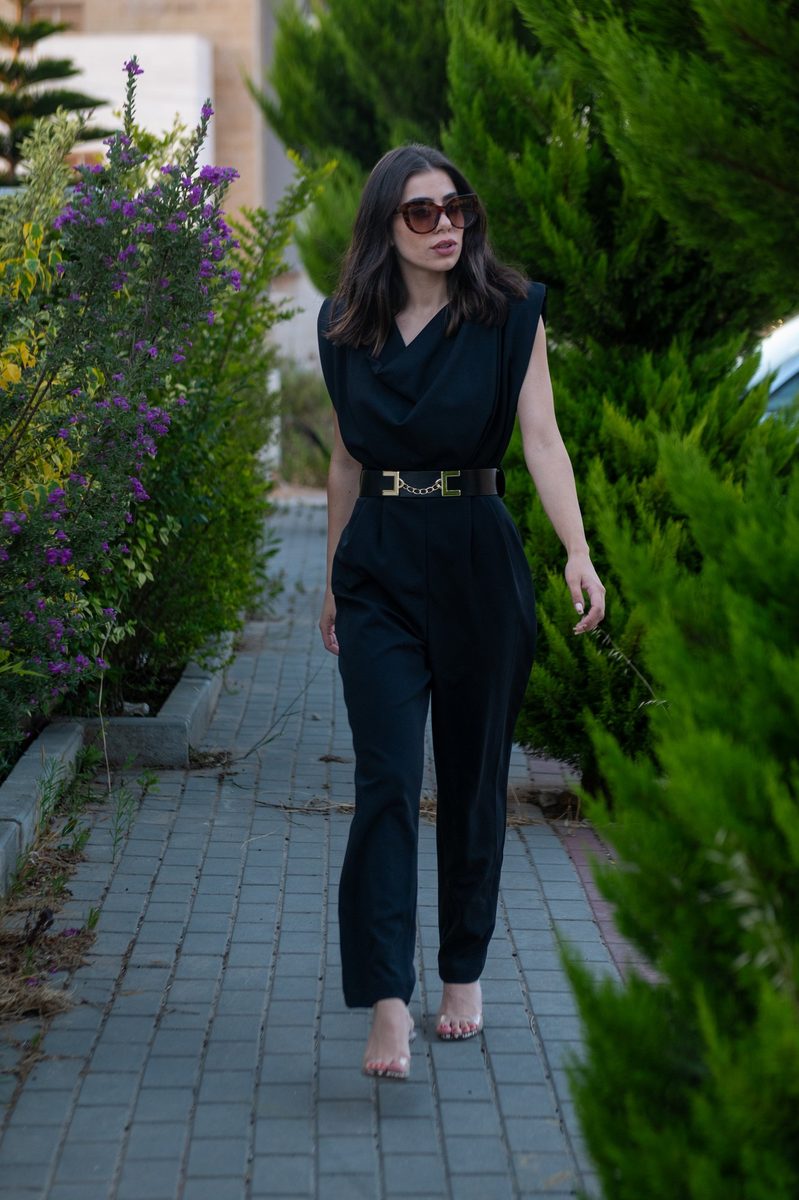 A black jumpsuit on a garden path